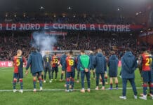 Calza rossoblù da rattoppare e svuotare del carbone nero